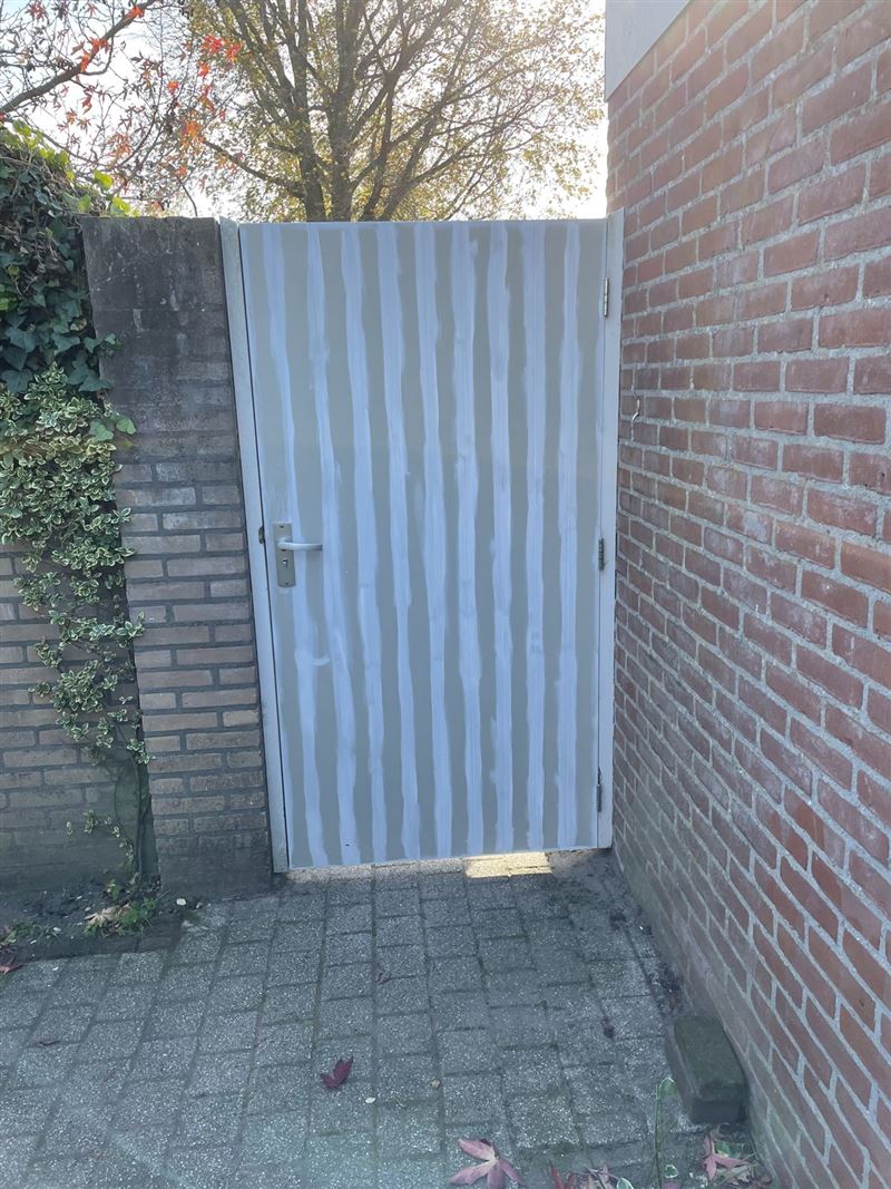 Poortdeur en schuurdeur vervangen in Aalst-Waalre